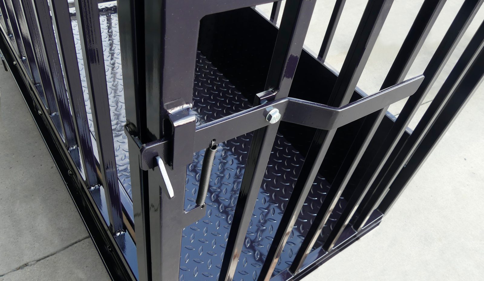 Close-up of a livestock weighing crate gate mechanism